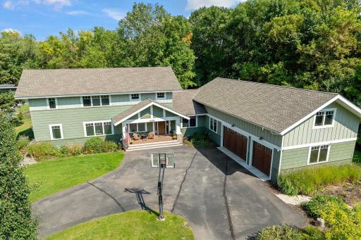 A spacious driveway perfect for parking and play, complete with a basketball hoop for endless fun.
