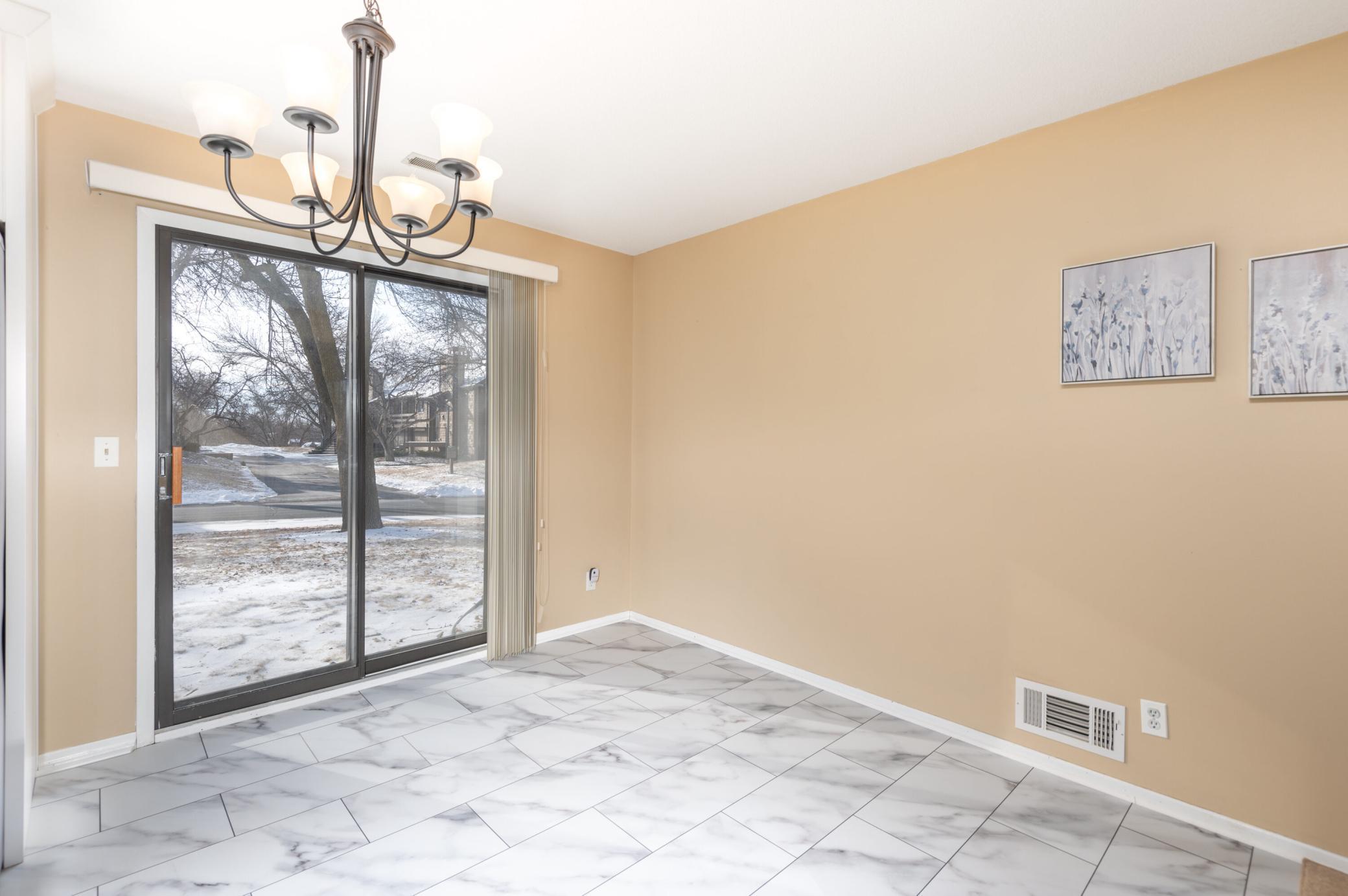 The Dining Area walks out to a flagstone patio.