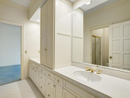 Jack and Jill bathroom has tons of storage and double sinks!