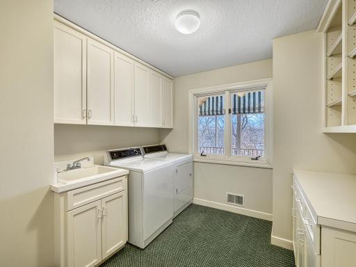 Main floor laundry and mudroom off of the 3 car garage.