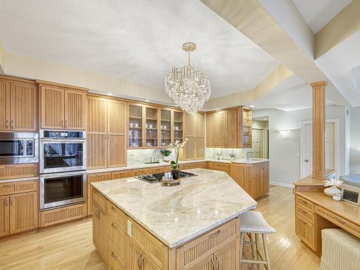Kitchen has double oven and solid surface counters.
