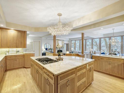 Impressive kitchen with custom cabinetry, and tiled backsplash.