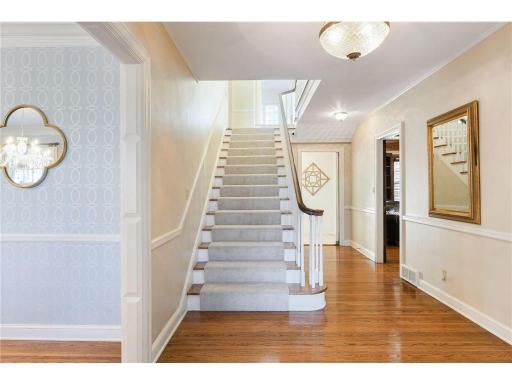 Welcome in! As you enter you are greeted by the stately front staircase
