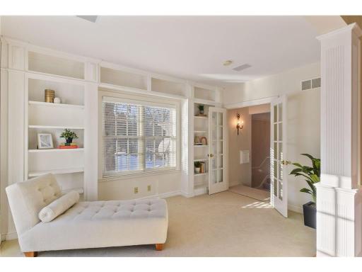 Features sitting room with balcony overlooking the pool