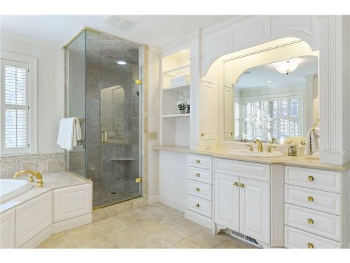 Large/walk-in shower with Travertine and Marble tile