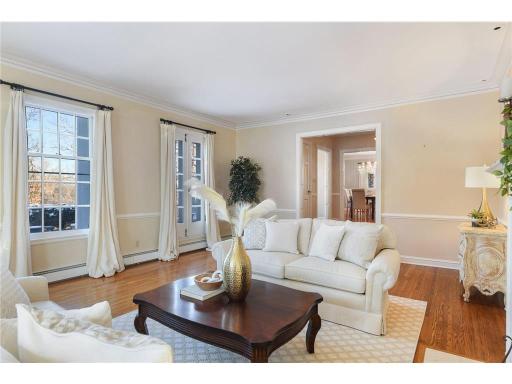 Floor to ceiling windows line the front living room