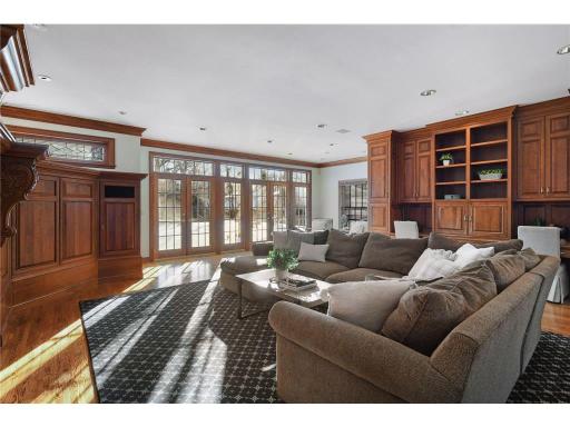 Floor to ceiling wall of windows overlooking the pool