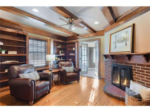 Main level den features the 2nd of 3 fireplaces on the main floor