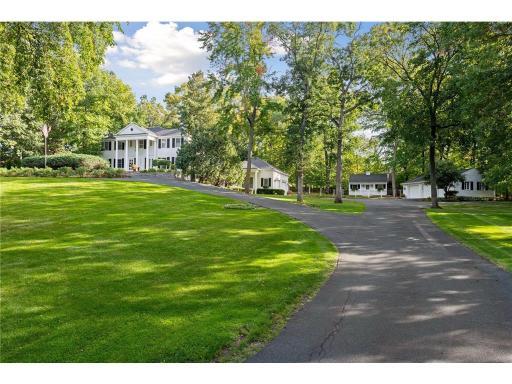 Nicknamed "White Oaks" due to it's stunning setting, the property features an 8,000 square foot home with an attached 2 car garage for automobile lovers, a detached 3 car garage a detached studio and pool