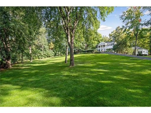 Nicknamed "White Oaks" due to it's stunning setting on 1.88 acres in Edina Minnesota