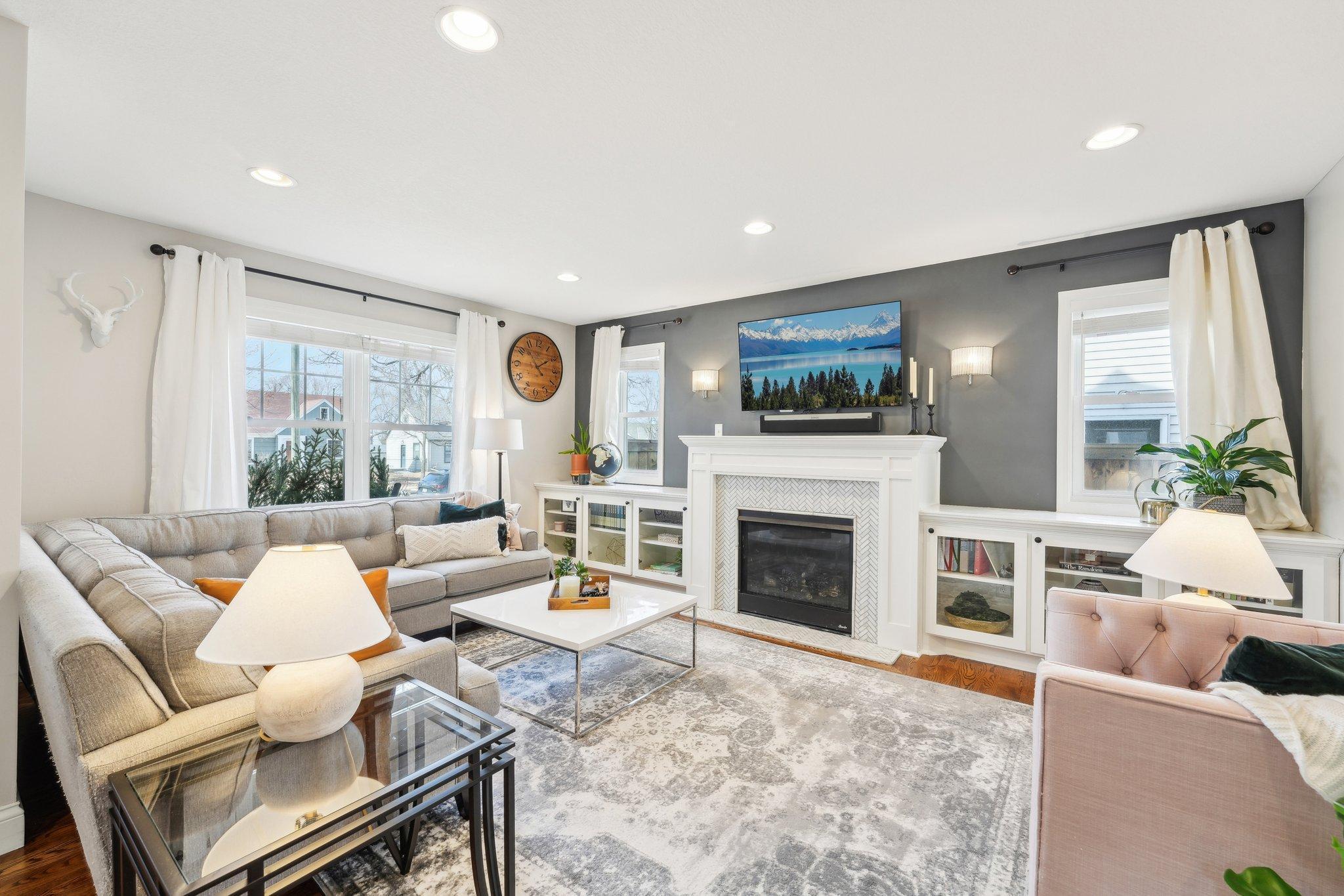 This home was completely renovated top-to-bottom in 2015/16. It looks & feels like a new-build! You're looking at the living room, featuring a gas fireplace and convenient, stylish built-in cabinets.