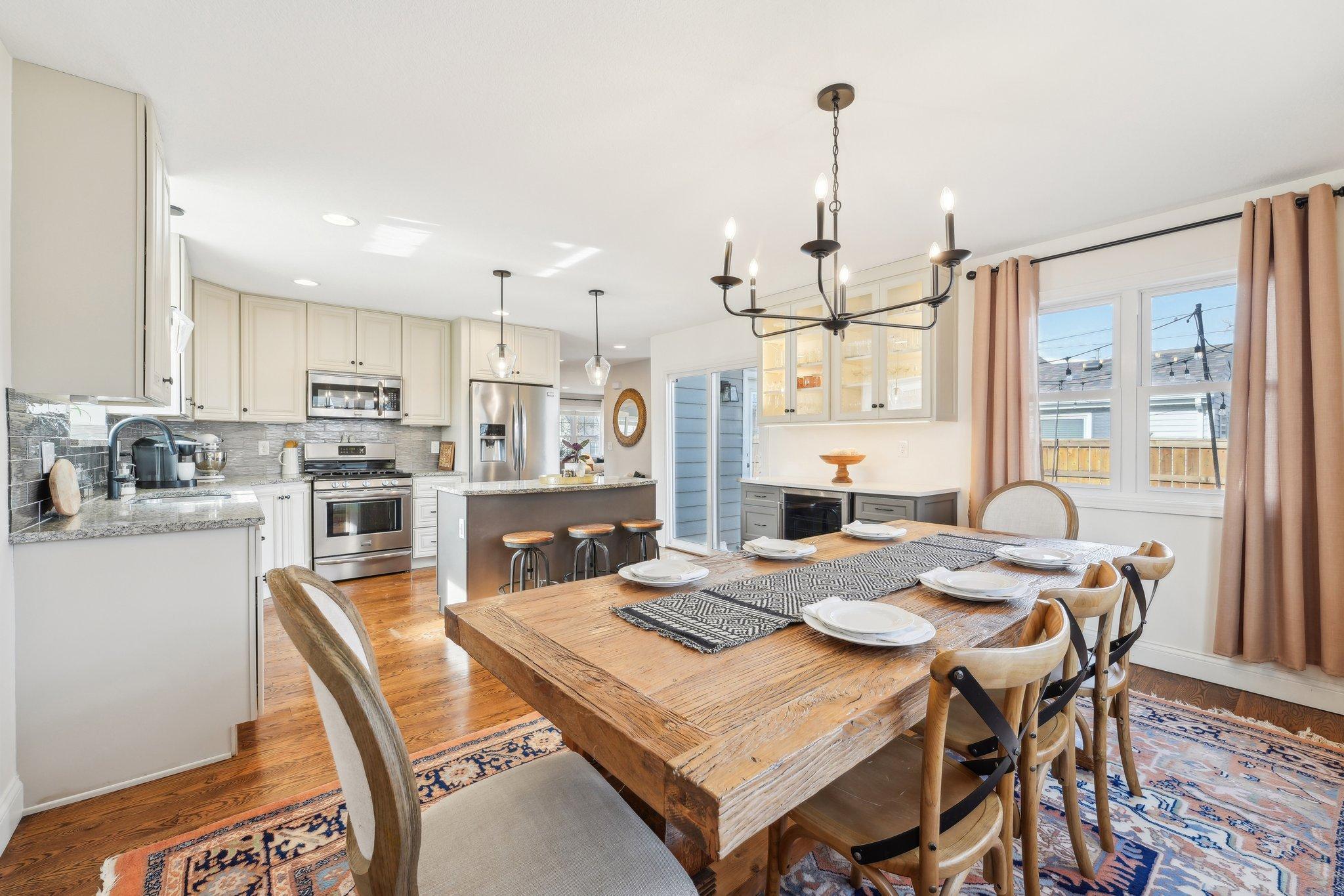 A view across the dining room into the kitchen. Notice the table for 8 fits comfortably in this large space!
