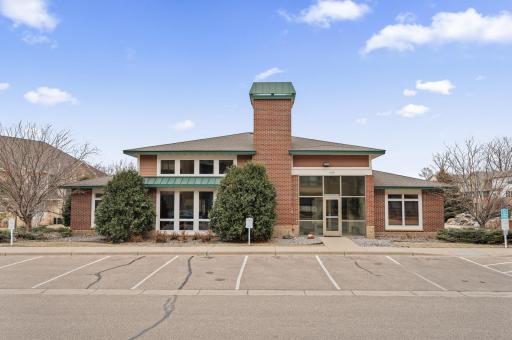 Community room with full kitchen and gathering area plus outdoor patio with grills