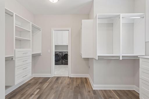 Primary walk-in closet is in close proximity to your main floor laundry for convenience.