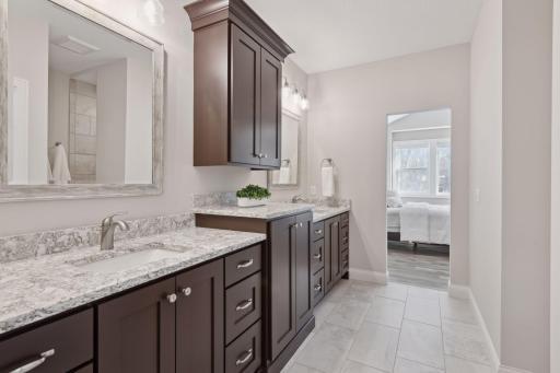 This expansive primary suite with impress.