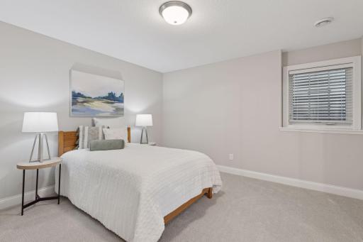 Third lower level bedroom is spacious and bright.