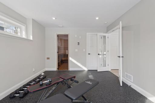 Private gym and sauna offers a space for the wellness guru in your family. This room could be converted into a bedroom in the future if desired.
