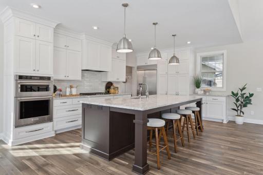 Oversized center island offers plenty of room to gather your loved ones.