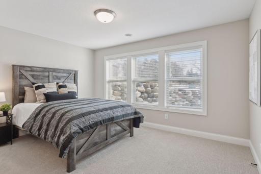 Spacious lower level bedroom.