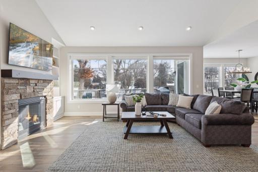 Main floor offers vaulted ceilings and panoramic views of water.