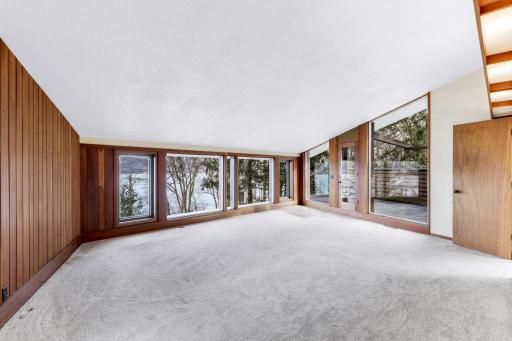 Primary bedroom suite with large picture windows for gorgeous sunrises.