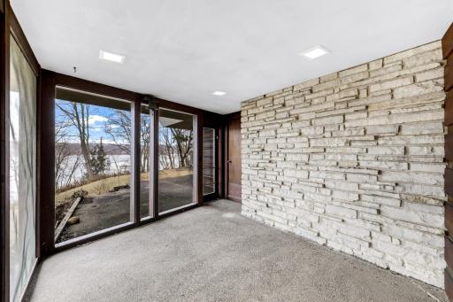 Screened-in porch off of the living room to enjoy warmer months.