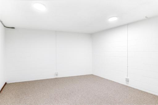 Additional room in lower level for storage or fitness space.