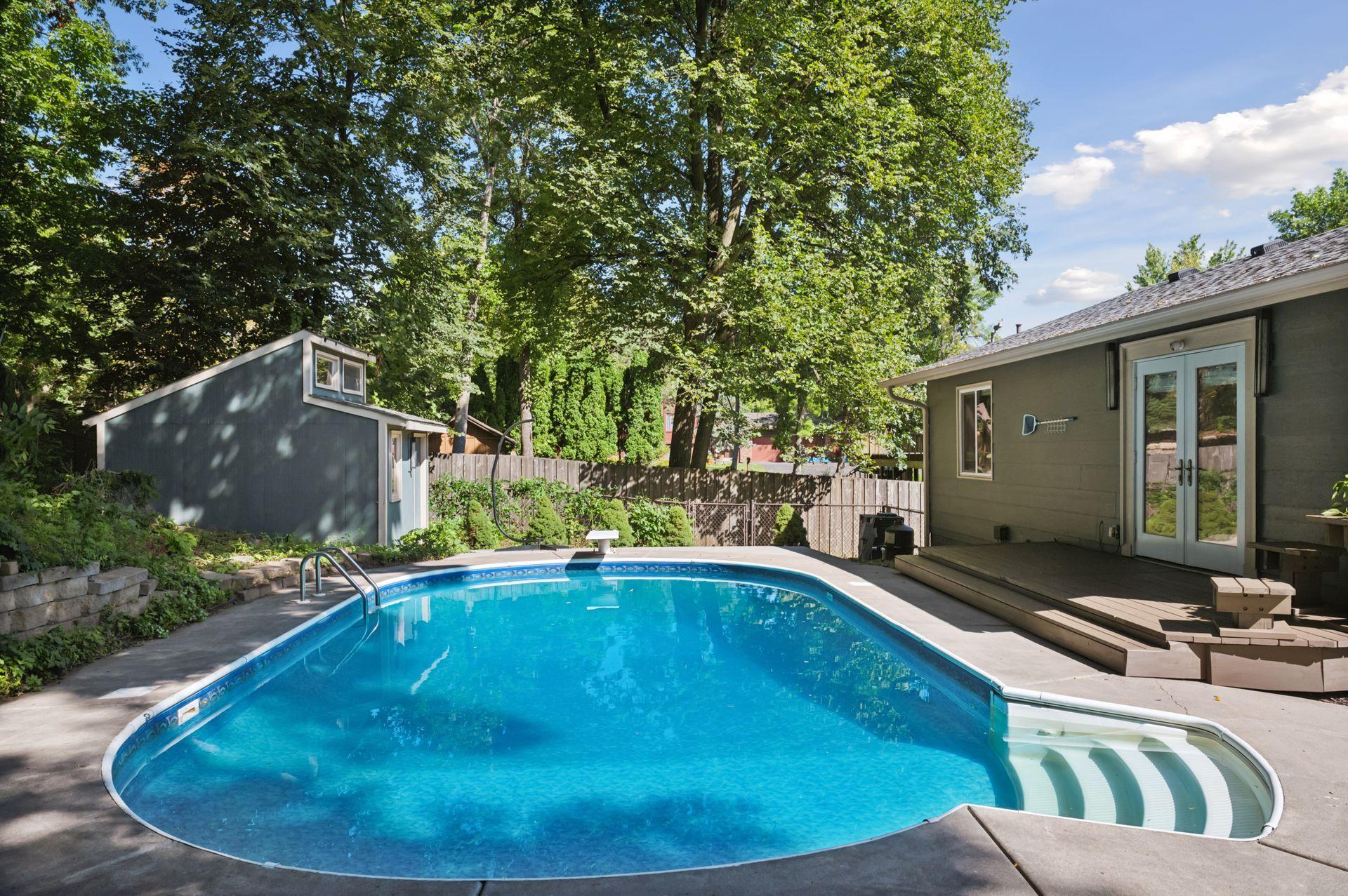 Pool with a view of the poolhouse