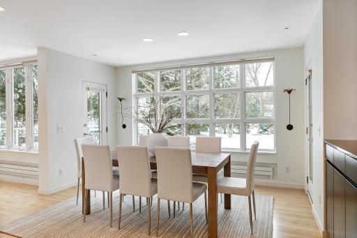 Formal dining with view of expansive backyard