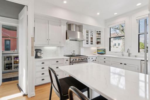 Kitchen windows look out over Mount Curve Avenue. Kitchen peninsula with breakfast area.