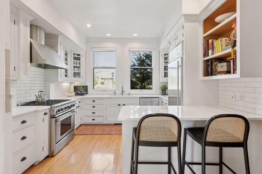 Light and bright updated kitchen with an adjacent butler's pantry and wet bar.