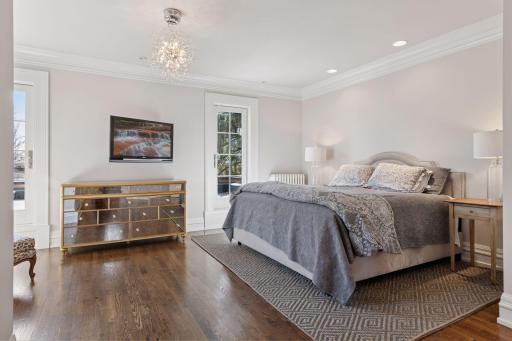 Primary bedroom suite with eastern and southern exposure and Minneapolis skyline views.