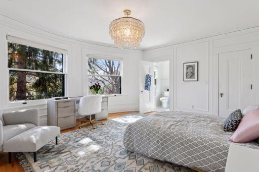 Spacious secondary bedroom with en suite 3/4 bathroom and walk-in closet.