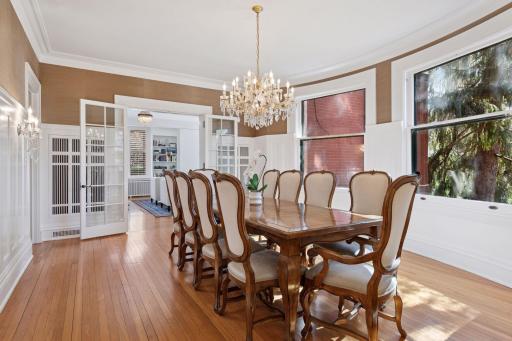 Glass paned french doors lead from the formal living room to the dining room.