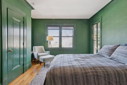 The third bedroom features northeastern exposure and french doors to the stair landing balcony.