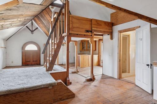 Former carriage house above garage. Kitchen and bathroom have been disconnected and are no longer functional. Sold "as is."