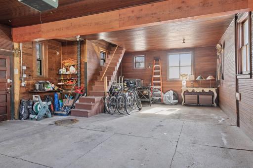 Excellent storage space and room for three vehicles. The staircase leads to a former carriage house. Beautiful original bead-board walls and ceiling.