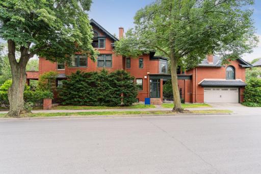 The original 3-car garage features a tandem 2-car stall and a single car stall with a staircase leading to a former carriage house. Wonderful opportunity to create a future dwelling space or studio above the garage.