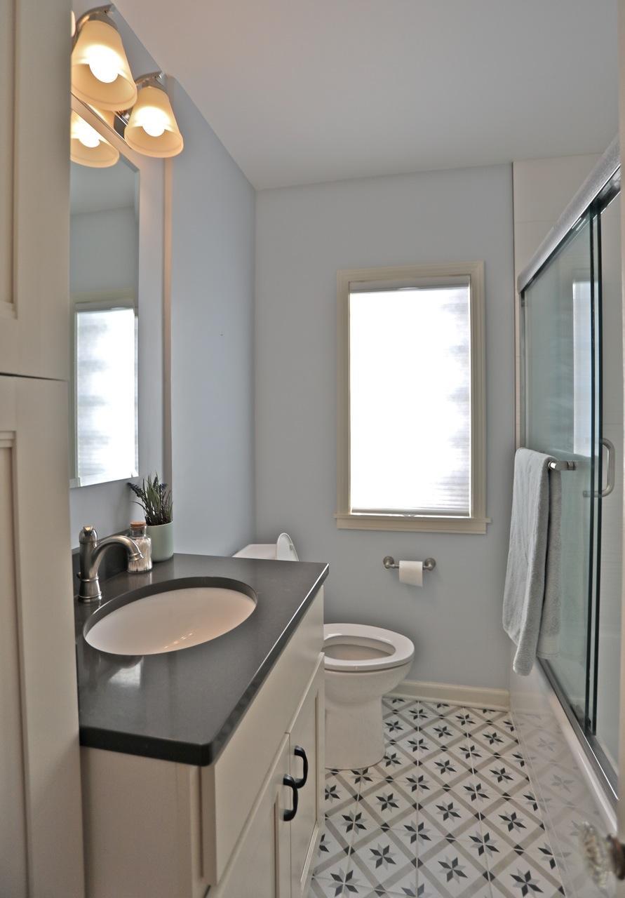 Full bath has attractive tiled flooring