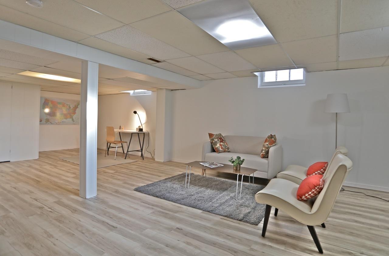 Lower level family room & den/office with new flooring