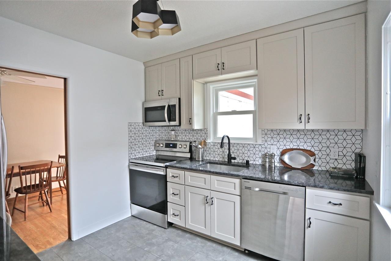 Tasteful total kitchen remodel in 2021 has quartz counters, & stainless steel appliances also new in 2021