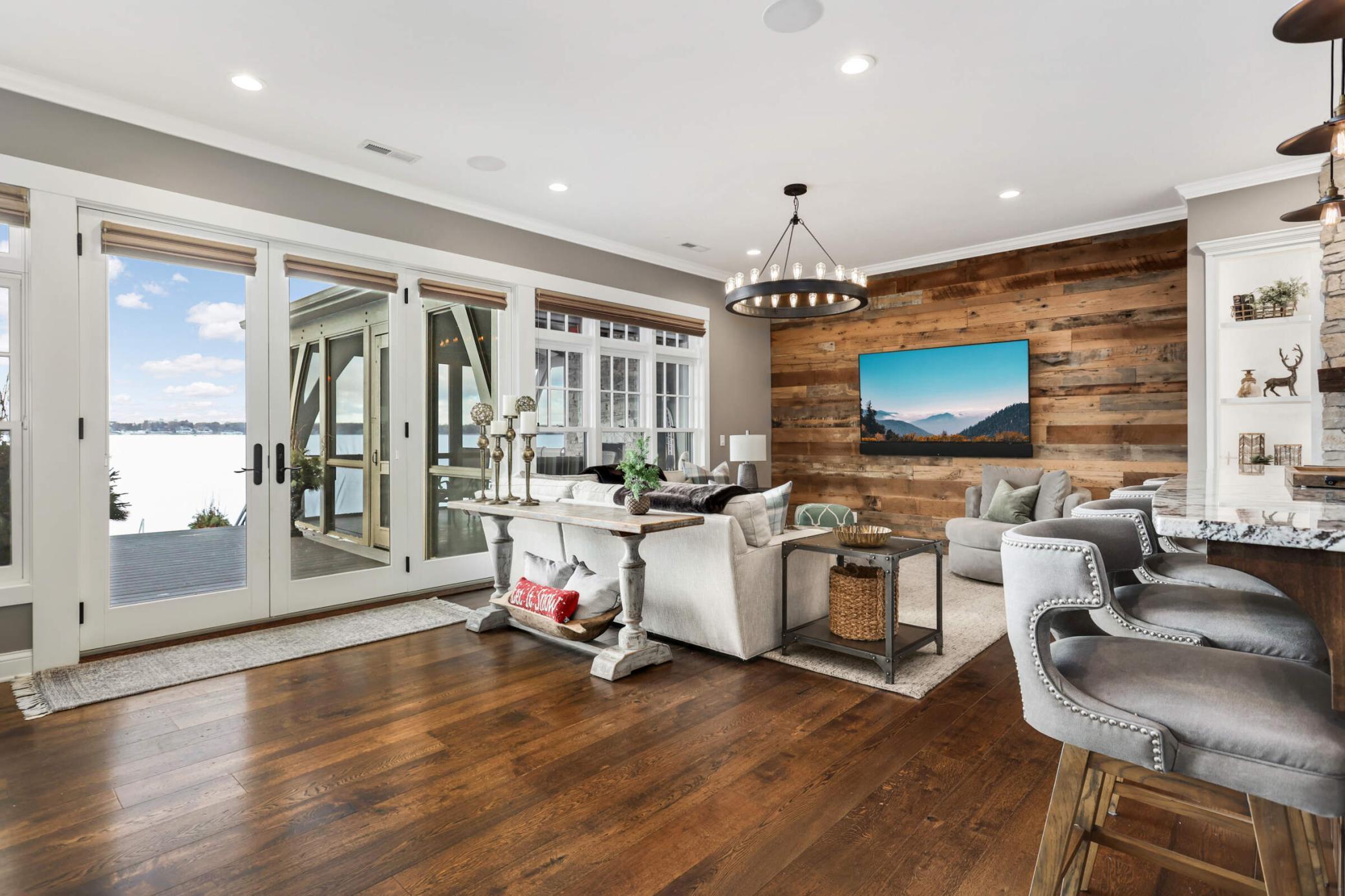 Another view of the family room, the lake view and 3 season porch