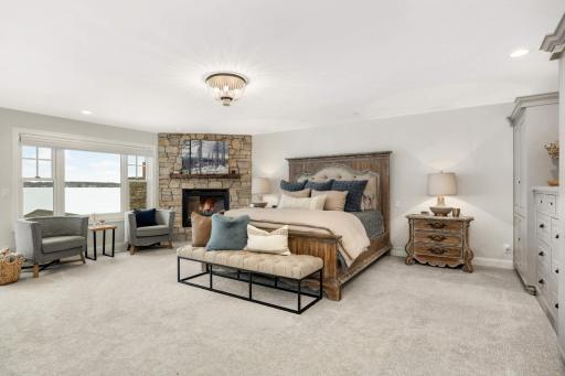 The perfect master with ample built in cabinets, fire place and one great lake view.