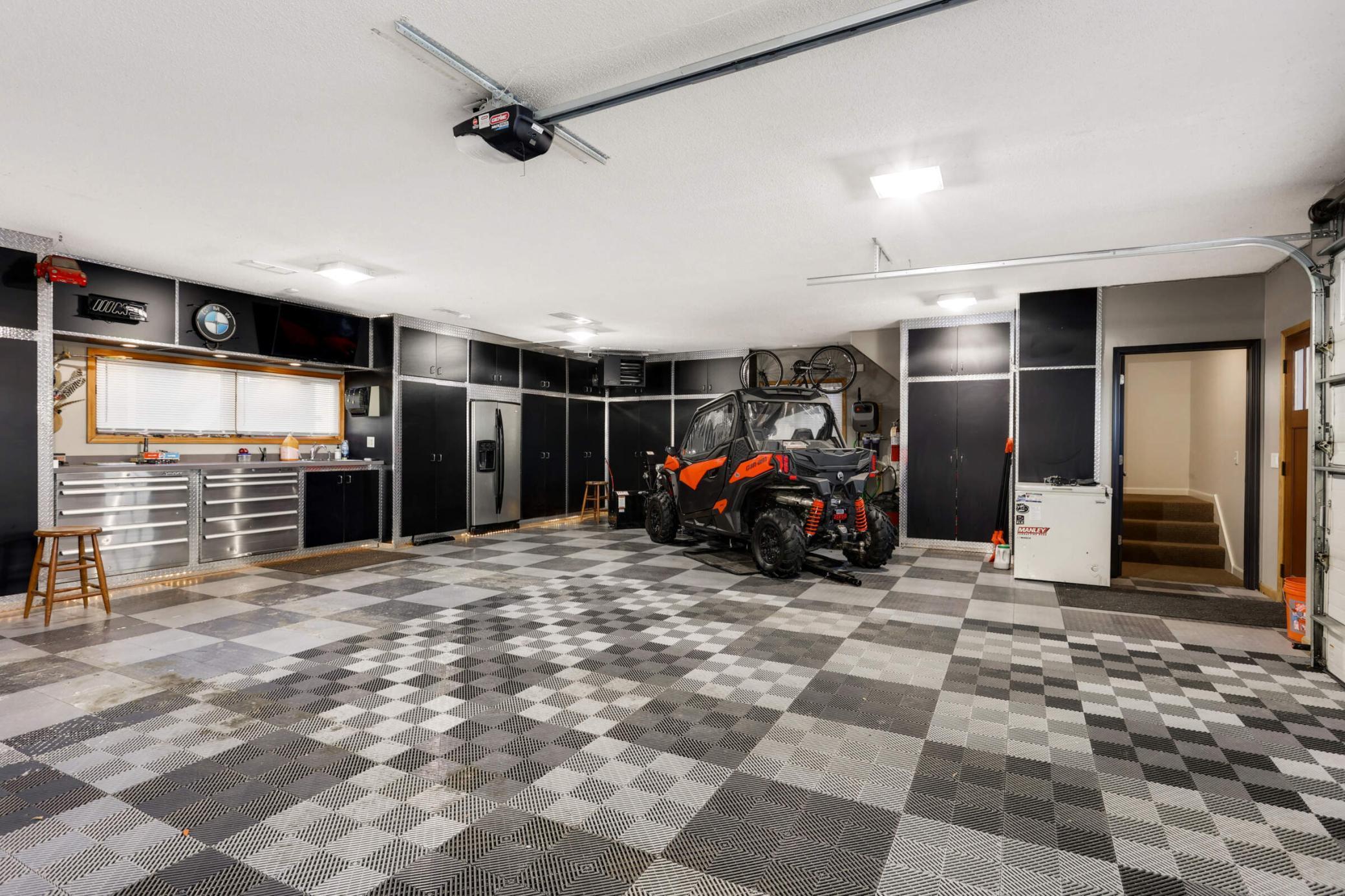 View of the fully finished garage - heated and fully plumbed. Drains in the finished floors too!