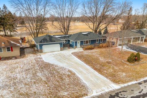 Large, concrete driveway with extra parking space. Backs up to the park!