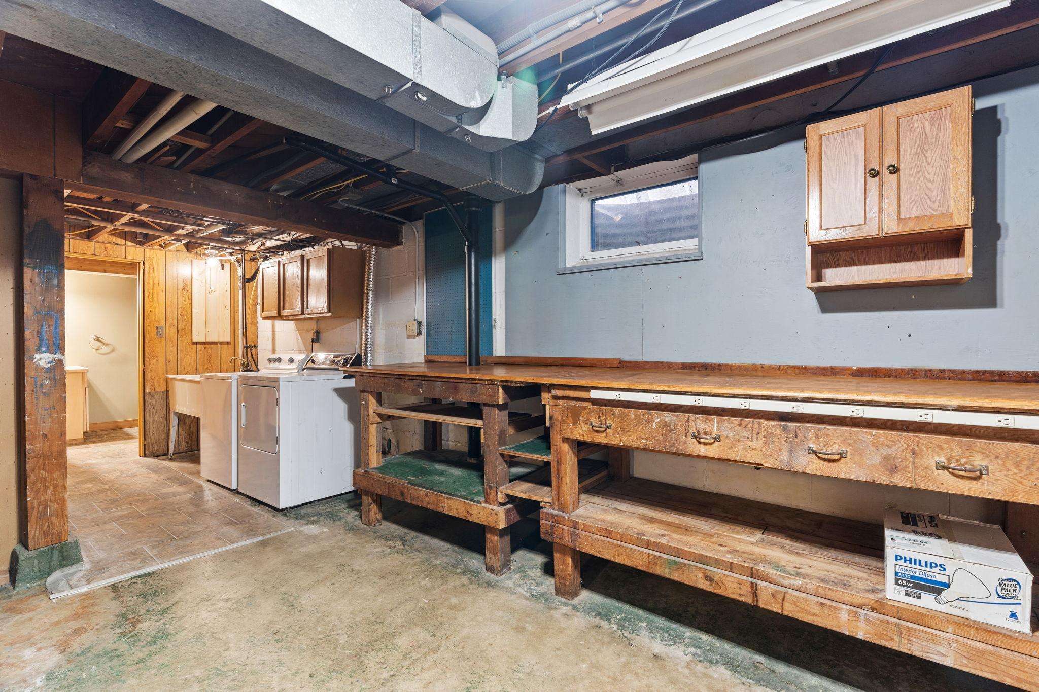 Storage and workshop area in basement.