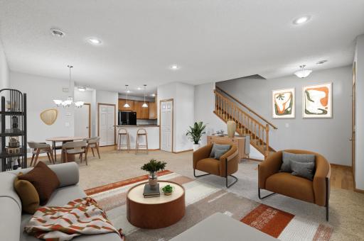 Recessed lights, modern light fixtures and a large window create for an airy and BRIGHT living space!