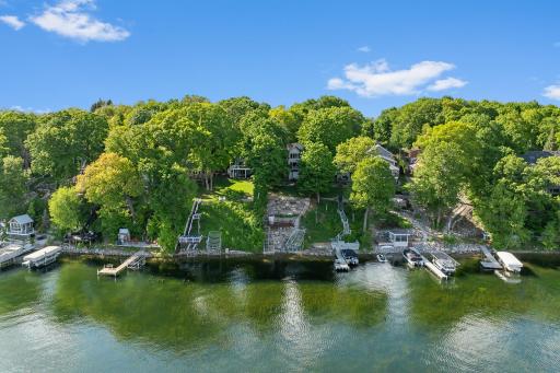 Lakefront property with a private half acre setting on Upper Prior! Incredible Value with the BEST Floorplan in this walkout two story - 4 large bedrooms including a DREAM Primary Suite layout with sunroom!