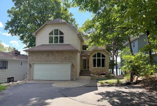 Stunning curb appeal and a great floorplan that offers 4 bedrooms including a "dream" layout for the Primary Suite with a Sunroom over looking the lake!