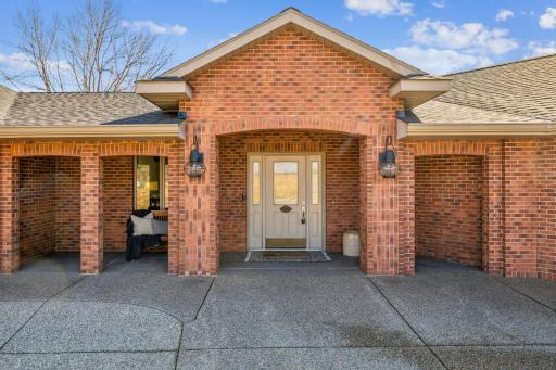 Completely refreshed brick in 2017 with exposed aggregate concrete entrance with covered front porch showcased here.